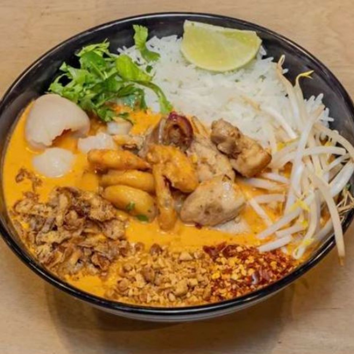 Thai curry and rice served with fresh vegetables